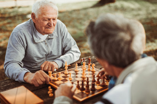 Luxury handcrafted Tunisian olive wood chess set, showcasing unique craftsmanship and traditional artistry.