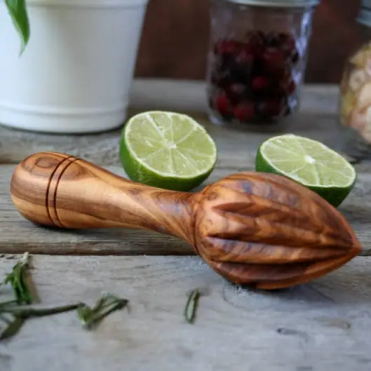 Handmade Tunisian olive wood citrus reamer, ideal for extracting fresh lemon, lime, and orange juice with ease.