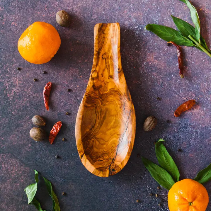 Beautifully crafted Tunisian olive wood spoon rest, designed to keep countertops clean while cooking.