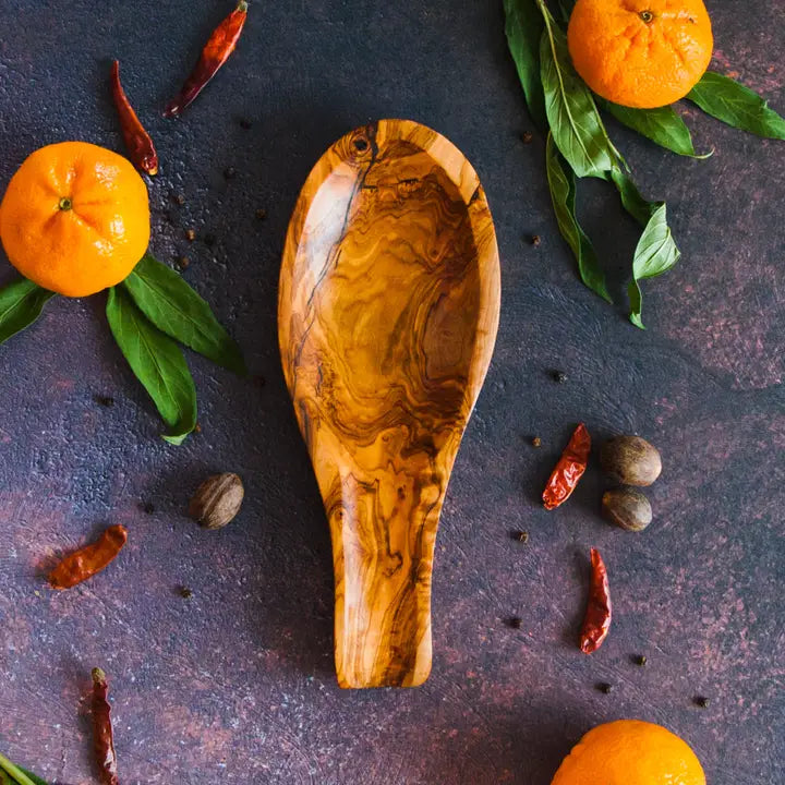 Beautifully crafted Tunisian olive wood spoon rest, designed to keep countertops clean while cooking.